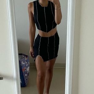 Super cute skirt and tank top set with white detailing on the front